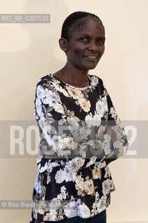 Vercelli october 26, 2023..Susan Nalugwa Kiguli, Ugandan poet and writer, associate professor of literature at the University of Makerere, supporter of creative writing in Africa, photographed in Vercelli in the main hall of the Lagrangia Classical High School during the Civil Poetry festival/Susan Nalugwa Kiguli poetessa e letterata ugandese, professore associato di letteratura presso lUniversità di Makerere, sostenitrice   della scrittura creativa in Africa, fotografata a Vercelli nellaula magna del Liceo Classico Lagrangia durante il festival di Poesia Civile. ©Rino Bianchi/Rosebud2