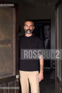 Brancaleone(RC) August 3, 2024..Alessio Torino, writer, Latinist, professor at the University of Urbino, photographed in Brancaleone in the confinement home of Cesare Pavese/Alessio Torino, scrittore, latinista, docente presso lUniversità di Urbino, fotografato a Brancaleone nella dimora di confino di Cesare Pavese. ©Rino Bianchi/Rosebud2