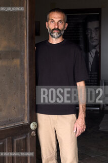 Brancaleone(RC) August 3, 2024..Alessio Torino, writer, Latinist, professor at the University of Urbino, photographed in Brancaleone in the confinement home of Cesare Pavese/Alessio Torino, scrittore, latinista, docente presso lUniversità di Urbino, fotografato a Brancaleone nella dimora di confino di Cesare Pavese. ©Rino Bianchi/Rosebud2