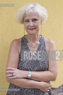 Brancaleone(RC) August 3, 2024..Cecilia Ricciarelli, bookseller, owner of the Italian bookshop Le Nuvole in Barcelona, ​​creator of the Italian Literature Festival of Barcelona (Flib), photographed in Brancaleone in the spaces of Cesare Paveses confinement home/Cecilia Ricciarelli, libraia, titolare della libreria italiana Le Nuvole a Barcellona, ideatrice del Festival Letteratura Italiana di Barcellona(Flib), fotografata a Brancaleone negli spazi della dimora di confino di Cesare Pavese. ©Rino Bianchi/Rosebud2