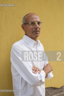 Brancaleone(RC) August 3, 2024..Tonino Tringali, lawyer, owner of what was the home of Cesare Pavese during his confinement in Brancaleone, photographed in the garden of the house/Tonino Tringali, avvocato,  proprietario di quella che fu la dimora di Cesare Pavese durante il confino a Brancaleone, fotografato nel giardino della dimora. ©Rino Bianchi/Rosebud2