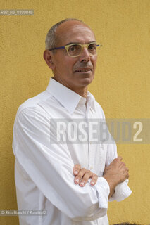 Brancaleone(RC) August 3, 2024..Tonino Tringali, lawyer, owner of what was the home of Cesare Pavese during his confinement in Brancaleone, photographed in the garden of the house/Tonino Tringali, avvocato,  proprietario di quella che fu la dimora di Cesare Pavese durante il confino a Brancaleone, fotografato nel giardino della dimora. ©Rino Bianchi/Rosebud2