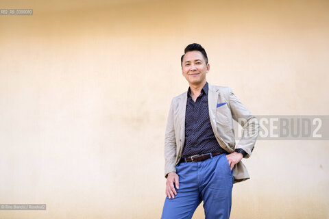 Novara September 2, 2024..Viet Thanh Nguyen blogger and writer of Vietnamese origins. He teaches English and American Studies and Ethnicity at the University of Southern California, Pulitzer Prize 2016, photographed in Novara in the spaces of the Castello Sforzesco/Viet Thanh Nguyen blogger e scrittore di origini vietnamite. Insegna English and American Studies and Ethnicity alla University of Southern California, Premio Pulitzer 2016, fotografato a Novara negli spazi del Castello Sforzesco. ©Rino Bianchi/Rosebud2