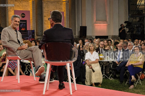 Rome July 3, 2025..Andrea Bajani, writer, interviewed by Pino Strabioli after having won, with the novel Lanniversario (Feltrinelli, 2025), the 79th edition of the Strega Prize and the Strega Giovani Prize at the Ninfeo di Villa Giulia/Andrea Bajani, scrittore, intervistato da Pino Strabioli dopo essersi aggiudicato, con il romanzo Lanniversario (Feltrinelli, 2025), la 79esima edizione del Premio Strega e il Premio Strega Giovani al Ninfeo di Villa Giulia. ©Rino Bianchi/Rosebud2