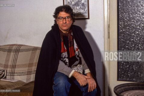 Rome March 20, 1993..Dario Bellezza, poet and writer, portrayed in his home on Via dei Pettinari in Rome/Dario Bellezza, poeta e scrittore, ritratto nella sua abitazione di via dei Pettinari a Roma. ©Rino Bianchi/Rosebud2