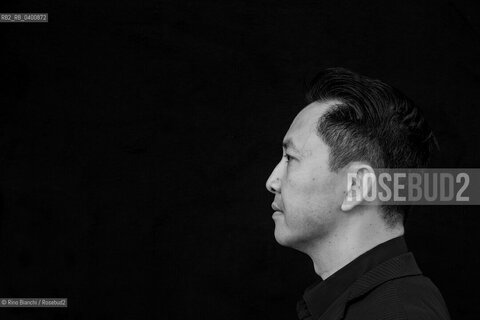 Rome July 13, 2017..Viet Thanh Nguyen, a US-born Vietnamese writer, Pulitzer Prize for fiction with her debut novel The sympathizer, photographed in Rome in the Basilica of Massenzio/Viet Thanh Nguyen, scrittore vietnamita naturalizzato statunitense, Premio Pulitzer per la narrativa con il suo romanzo desordio Il simpatizzante, fotografato a Roma nella Basilica di Massenzio.. ©Rino Bianchi/Rosebud2