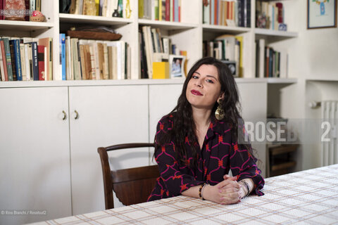 Turin January 19, 2026..Monica Acito, writer, middle school humanities teacher, and contributor to the cultural supplement Robinson, photographed in her home in the Quadrilatero district of Turin/Monica Acito scrittrice, docente di discipline umanistiche presso la scuola secondaria di primo e secondo grado, collaboratrice dellinserto culturale Robinson, fotografata nella sua abitazione nel Quadrilatero di Torino. ©Rino Bianchi/Rosebud2