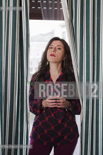 Turin January 19, 2026..Monica Acito, writer, middle school humanities teacher, and contributor to the cultural supplement Robinson, photographed in her home in the Quadrilatero district of Turin/Monica Acito scrittrice, docente di discipline umanistiche presso la scuola secondaria di primo e secondo grado, collaboratrice dellinserto culturale Robinson, fotografata nella sua abitazione nel Quadrilatero di Torino. ©Rino Bianchi/Rosebud2