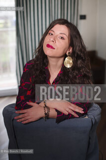 Turin January 19, 2026..Monica Acito, writer, middle school humanities teacher, and contributor to the cultural supplement Robinson, photographed in her home in the Quadrilatero district of Turin/Monica Acito scrittrice, docente di discipline umanistiche presso la scuola secondaria di primo e secondo grado, collaboratrice dellinserto culturale Robinson, fotografata nella sua abitazione nel Quadrilatero di Torino. ©Rino Bianchi/Rosebud2