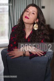 Turin January 19, 2026..Monica Acito, writer, middle school humanities teacher, and contributor to the cultural supplement Robinson, photographed in her home in the Quadrilatero district of Turin/Monica Acito scrittrice, docente di discipline umanistiche presso la scuola secondaria di primo e secondo grado, collaboratrice dellinserto culturale Robinson, fotografata nella sua abitazione nel Quadrilatero di Torino. ©Rino Bianchi/Rosebud2