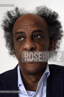 Rome March 21, 2026..Dinaw Mengestu, an Ethiopian-born American writer and novelist, a contributor to Rolling Stone, Harpers, The Wall Street Journal, and many other publications, and director of the written arts program at Bard College, photographed in Rome near Piazza Euclide/Dinaw Mengestu, scrittore e romanziere etiope naturalizzato statunitense, collaboratore delle riviste Rolling Stone,  Harpers, The Wall Street Journal e molte altre pubblicazioni, direttore del programma di arte scritta al Bard College, fotografato a Roma nei pressi di piazza Euclide. ©Rino Bianchi/Rosebud2