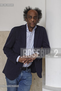 Rome March 21, 2026..Dinaw Mengestu, an Ethiopian-born American writer and novelist, a contributor to Rolling Stone, Harpers, The Wall Street Journal, and many other publications, and director of the written arts program at Bard College, photographed in Rome near Piazza Euclide/Dinaw Mengestu, scrittore e romanziere etiope naturalizzato statunitense, collaboratore delle riviste Rolling Stone,  Harpers, The Wall Street Journal e molte altre pubblicazioni, direttore del programma di arte scritta al Bard College, fotografato a Roma nei pressi di piazza Euclide. ©Rino Bianchi/Rosebud2