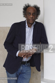 Rome March 21, 2026..Dinaw Mengestu, an Ethiopian-born American writer and novelist, a contributor to Rolling Stone, Harpers, The Wall Street Journal, and many other publications, and director of the written arts program at Bard College, photographed in Rome near Piazza Euclide/Dinaw Mengestu, scrittore e romanziere etiope naturalizzato statunitense, collaboratore delle riviste Rolling Stone,  Harpers, The Wall Street Journal e molte altre pubblicazioni, direttore del programma di arte scritta al Bard College, fotografato a Roma nei pressi di piazza Euclide. ©Rino Bianchi/Rosebud2