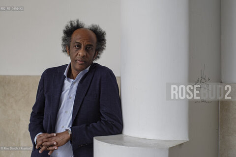 Rome March 21, 2026..Dinaw Mengestu, an Ethiopian-born American writer and novelist, a contributor to Rolling Stone, Harpers, The Wall Street Journal, and many other publications, and director of the written arts program at Bard College, photographed in Rome near Piazza Euclide/Dinaw Mengestu, scrittore e romanziere etiope naturalizzato statunitense, collaboratore delle riviste Rolling Stone,  Harpers, The Wall Street Journal e molte altre pubblicazioni, direttore del programma di arte scritta al Bard College, fotografato a Roma nei pressi di piazza Euclide. ©Rino Bianchi/Rosebud2