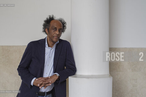 Rome March 21, 2026..Dinaw Mengestu, an Ethiopian-born American writer and novelist, a contributor to Rolling Stone, Harpers, The Wall Street Journal, and many other publications, and director of the written arts program at Bard College, photographed in Rome near Piazza Euclide/Dinaw Mengestu, scrittore e romanziere etiope naturalizzato statunitense, collaboratore delle riviste Rolling Stone,  Harpers, The Wall Street Journal e molte altre pubblicazioni, direttore del programma di arte scritta al Bard College, fotografato a Roma nei pressi di piazza Euclide. ©Rino Bianchi/Rosebud2