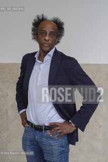 Rome March 21, 2026..Dinaw Mengestu, an Ethiopian-born American writer and novelist, a contributor to Rolling Stone, Harpers, The Wall Street Journal, and many other publications, and director of the written arts program at Bard College, photographed in Rome near Piazza Euclide/Dinaw Mengestu, scrittore e romanziere etiope naturalizzato statunitense, collaboratore delle riviste Rolling Stone,  Harpers, The Wall Street Journal e molte altre pubblicazioni, direttore del programma di arte scritta al Bard College, fotografato a Roma nei pressi di piazza Euclide. ©Rino Bianchi/Rosebud2