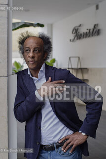 Rome March 21, 2026..Dinaw Mengestu, an Ethiopian-born American writer and novelist, a contributor to Rolling Stone, Harpers, The Wall Street Journal, and many other publications, and director of the written arts program at Bard College, photographed in Rome near Piazza Euclide/Dinaw Mengestu, scrittore e romanziere etiope naturalizzato statunitense, collaboratore delle riviste Rolling Stone,  Harpers, The Wall Street Journal e molte altre pubblicazioni, direttore del programma di arte scritta al Bard College, fotografato a Roma nei pressi di piazza Euclide. ©Rino Bianchi/Rosebud2