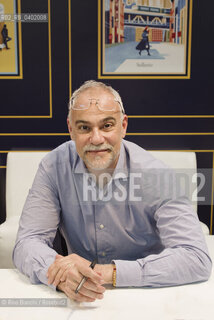 Turin May 17, 2026..Marco Malvaldi, a writer, made his fiction debut in 2007 with the mystery novel set on the Tuscan coast, La briscola in cinque, which was included in the collection I romanzi del BarLume, and was photographed in Turin at the stand of his publisher, Sellerio/Marco Malvaldi scrittore, ha esordito nella narrativa nel 2007 con il giallo ambientato sulla costa toscana La briscola in cinque,  entrato nella raccolta I romanzi del BarLume, fotografato a Torino nello stand del suo editore Sellerio. ©Rino Bianchi/Rosebud2