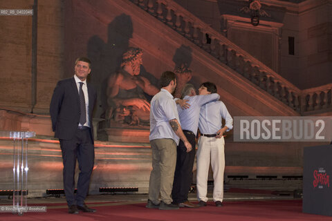 Rome, July 8, 2026.Michele Mari, after winning the 80th edition of the Strega Prize, embraces his children as Andrea DAngelo look on/Michele Mari, dopo laffermazione alla 80 edizione del Premio Strega, abbraccia i figli sotto lo sguardo di Andrea DAngelo ©Rino Bianchi/Rosebud2