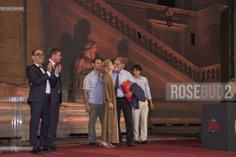 Rome, July 8, 2026.Michele Mari, after winning the 80th edition of the Strega Prize, kisses his wife as his sons, Pino Strabioli and Andrea DAngelo, look on/Michele Mari, dopo laffermazione alla 80 edizione del Premio Strega, bacia la moglie sotto lo sguardo dei figli, di Pino Strabioli ed Andrea DAngelo ©Rino Bianchi/Rosebud2