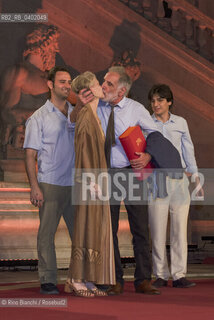 Rome, July 8, 2026.Michele Mari, after winning the 80th edition of the Strega Prize, kisses his wife as his sons, Pino Strabioli and Andrea DAngelo, look on/Michele Mari, dopo laffermazione alla 80 edizione del Premio Strega, bacia la moglie sotto lo sguardo dei figli. ©Rino Bianchi/Rosebud2