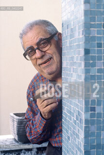 Rome May 4, 1993..Benito Franco Giuseppe Jacovitti, cartoonist, author of famous comic book characters such as Cocco Bill and Cip the Archpoliceman, graphic novels such as Kamasultra and the famous Diario Vitt, published since 1949 and which between the 1960s and 1970s sold over 3 million copies a year, exceeding a total of 100 million copies, photographed in his home in Rome/Benito Franco Giuseppe Jacovitti, fumettista, autore di celebri personaggi dei fumetti come Cocco Bill e Cip larcipoliziotto, di romanzi grafici come Kamasultra e del celebre Diario Vitt, edito dal 1949 e che fra gli anni sessanta e settanta arrivò a vendere oltre 3 milioni di copie lanno superando un totale di 100 milioni di copie, fotografato a Roma nella sua abitazione. ©Rino Bianchi/Rosebud2