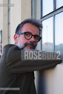 Biella, September 11, 2026..Guido Catalano, an Italian poet and writer who writes for *Il Corriere della Sera Torino* and *Torino Sette* (part of *La Stampa*) and collaborates with *Smemoranda*, photographed in Biella in front of the former De Agostini factory during the Fuoriluogo Festival/Guido Catalano poeta e scrittore italiano, scrive per Il Corriere della Sera Torino, Torino Sette de La Stampa e collabora con Smemoranda, fotografato a Biella davanti lex Opificio De Agostini durante il Festival Fuoriluogo. ©Rino Bianchi/Rosebud2