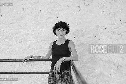 Biella September 12, 2026..Eleni Molos—actress, voice actor, author of essays and educational texts, and writer—photographed in Biella at the former De Agostini factory complex during the Fuoriluogo Festival/Eleni Molos, attrice, doppiatrice, autrice disaggi e testi per la scuola, scrittrice, fotografata a Biella negli spazi dellEx Opicicio De Agostini durante il Festival Fuoriluogo. ©Rino Bianchi/Rosebud2