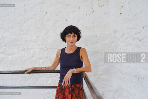 Biella September 12, 2026..Eleni Molos—actress, voice actor, author of essays and educational texts, and writer—photographed in Biella at the former De Agostini factory complex during the Fuoriluogo Festival/Eleni Molos, attrice, doppiatrice, autrice disaggi e testi per la scuola, scrittrice, fotografata a Biella negli spazi dellEx Opicicio De Agostini durante il Festival Fuoriluogo. ©Rino Bianchi/Rosebud2