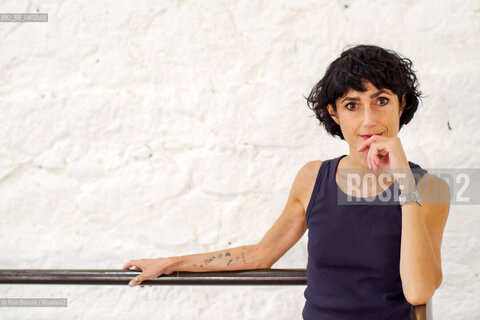 Biella September 12, 2026..Eleni Molos—actress, voice actor, author of essays and educational texts, and writer—photographed in Biella at the former De Agostini factory complex during the Fuoriluogo Festival/Eleni Molos, attrice, doppiatrice, autrice disaggi e testi per la scuola, scrittrice, fotografata a Biella negli spazi dellEx Opicicio De Agostini durante il Festival Fuoriluogo. ©Rino Bianchi/Rosebud2