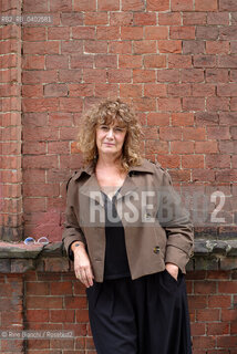 Turin September 30, 2026..Elena Varvello—poet, writer, and instructor at the Scuola Holden—photographed on the schools premises within the former Cavalli Barracks at the Turin Military Arsenal in the Borgo Dora district/Elena Varvello poetessa, scrittrice, docente della Scuola Holden, fotografata negli spazi della scuola nellex lex Caserma Cavalli dellArsenale militare di Torino, a Borgo Dora. ©Rino Bianchi/Rosebud2