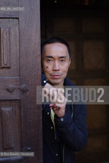 Turin October 11, 2026..Tash Aw, a Malaysian writer of Chinese ethnicity born in Taiwan, photographed in Turin inside the Church of San Filippo Neri during the Portici di Carta event/Tash Aw, scrittore malese di etnia cinese nato a Taiwan, fotografato a Torino negli spazi della chiesa San Filippo Neri durante Portici di carta ©Rino Bianchi/Rosebud2