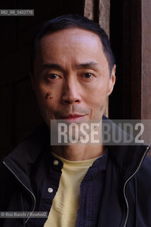 Turin October 11, 2026..Tash Aw, a Malaysian writer of Chinese ethnicity born in Taiwan, photographed in Turin inside the Church of San Filippo Neri during the Portici di Carta event/Tash Aw, scrittore malese di etnia cinese nato a Taiwan, fotografato a Torino negli spazi della chiesa San Filippo Neri durante Portici di carta ©Rino Bianchi/Rosebud2