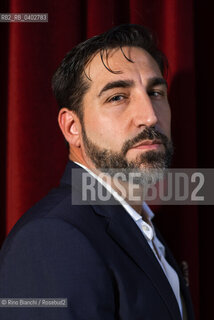 Turin October 9, 2026..Piergiorgio Pulixi, a writer and author of thrillers and noir fiction, photographed in Turin at the Circolo dei Lettori/Piergiorgio Pulixi, scrittore, autore di thriller e noir, fotografato a Torino negli ambienti del Circolo dei lettori. ©Rino Bianchi/Rosebud2
