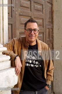 Turin October 11, 2026..Luca Bianchini—writer, advertising professional, freelance copywriter, and radio host—photographed in front of the Church of San Filippo Neri in Turin during the Portici di Carta event/Luca Bianchini scrittore, pubblicitario, copywriter free-lance, conduttore radiofonico, fotografato dinanzi alla chiesa di San Filippo Neri a Torino durante Portici di carta. ©Rino Bianchi/Rosebud2