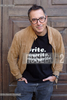 Turin October 11, 2026..Luca Bianchini—writer, advertising professional, freelance copywriter, and radio host—photographed in front of the Church of San Filippo Neri in Turin during the Portici di Carta event/Luca Bianchini scrittore, pubblicitario, copywriter free-lance, conduttore radiofonico, fotografato dinanzi alla chiesa di San Filippo Neri a Torino durante Portici di carta. ©Rino Bianchi/Rosebud2