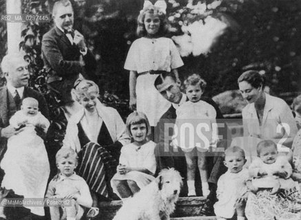 1922, Villar Perosa (Turin, Italy):  Agnelli Family. From the left: Carlo Nasi (standing), his daughter Clara Nasi, founder of FIAT Automobile Factory  Giovanni Agnelli senior (seated) with his little granddaughter Susanna Agnelli (daughter of Edoardo), Clara Boselli Agnelli (wife of Giovanni) with her hand on the shoulder of her grandson Giovanni Nasi (son of Carlo Nasi), Laura Nasi (daughter of Carlo Nasi), Edoardo Agnelli (son of Giovanni senior and father of Gianni), his daughter Clara Agnelli and his wife Virginia Agnelli (Princess Bourbon Del Monte di San Faustino), Aniceta Agnelli (daughter of Giovanni Agnelli senior and wife of Carlo Nasi) holding her little daughter Umberta Nasi in her arms and Gianni Agnelli (1921-2003, son of Edoardo and nephew of Aniceta) seated on the stairs / 1922, Villar Perosa (Torino): La famiglia Agnelli. Da sinistra: Carlo Nasi (in piedi), sua figlia Clara Nasi, il fondatore della FIAT Giovanni Agnelli senior (seduto) con la sua nipotina Susanna Agnelli (figlia di Edoardo), Clara Boselli Agnelli (moglie di Giovanni) con la mano sulla spalla del nipotino Giovanni Nasi (figlio di Carlo Nasi), Laura Nasi (figlia di Carlo Nasi), Edoardo Agnelli (figlio di Giovanni senior e padre di Gianni), sua figlia Clara Agnelli e sua moglie Virginia Agnelli (Principessa Bourbon Del Monte di San Faustino), Aniceta Agnelli (figlia di Giovanni senior e moglie di Carlo Nasi) con in braccio sua figlia Umberta Nasi e Gianni Agnelli (1921-2003, figlio di Edoardo e nipote di Aniceta) seduto sulle scale - Reproduced by MaMoArchives/Rosebud2