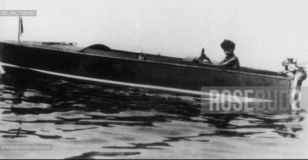 c. 1927 Gianni Agnelli (future industrialist and principal shareholder of FIAT Automobile Factory) as a child on a boat / 1927 c.: Gianni Agnelli (futuro industriale e principale azionista della FIAT) tda bambino in barca - Reproduced by MaMoArchives/Rosebud2