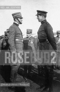 c.1918: The aviator and war hero Francesco Baracca meets the King of Belgium Albert I, father of Queen Maria José of Italy. In the middle, General Armando Diaz / 1918 c.: Laviatore ed eroe di guerra Francesco Baracca incontra il re del Belgio Alberto I, padre della regina dItalia Maria José. Al centro, il generale Armando Diaz - Reproduced by MaMoArchives/Rosebud2