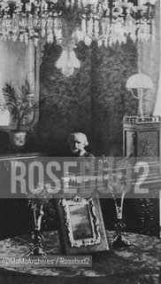 Milan, c. 1900: Italian composer Giuseppe Verdi sitting at his desk in the Suite 105 of the Grand Hotel et de Milan where he lived the last years of his life / Milano, 1900 c.: Il compositore Giuseppe Verdi seduto alla sua scrivania nella Suite 105 del Grand Hotel et de Milan, dove visse gli ultimi anni della sua vita - Reproduced by MaMoArchives/Rosebud2