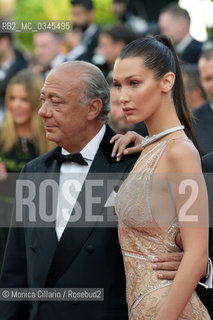 La top model Bella Hadid e Fawaz Gruosi sul red carpet alla premiere di Café Society durante la 69esima edizione del Festival del Cinema di Cannes, al Palais des Festivals, maggio 2016Model Bella Hadid and Fawaz Gruosi attend the Cafe Society premiere and the Opening Night Gala during the 69th annual Cannes Film Festival at the Palais des Festivals on May 11, 2016 ©Monica Cillario/Rosebud2