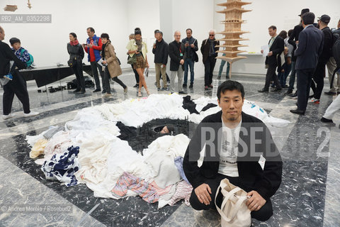 Lartista giapponese Takahiro Iwasaki posa accanto sue opere, intitolate Turned Upside Down, Its a Forest, esposte nel Padiglione Giappone, alla 57° edizione della  Biennale Arte di Venezia, 10 maggio 2017. .Japan artist Takahiro Iwasaki poses next his artistic works, titled Turned Upside Down, Its a Forest, inside Japan Pavilion, at Biennale Modern Art in Venice, may 10, 2017. ©Andrea Merola/Rosebud2