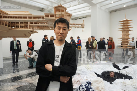 Lartista giapponese Takahiro Iwasaki posa accanto sue opere, intitolate Turned Upside Down, Its a Forest, esposte nel Padiglione Giappone, alla 57° edizione della  Biennale Arte di Venezia, 10 maggio 2017. .Japan artist Takahiro Iwasaki poses next his artistic works, titled Turned Upside Down, Its a Forest, inside Japan Pavilion, at Biennale Modern Art in Venice, may 10, 2017. ©Andrea Merola/Rosebud2