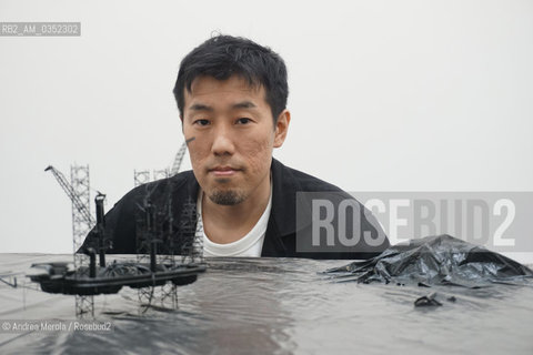 Lartista giapponese Takahiro Iwasaki posa accanto sue opere, intitolate Turned Upside Down, Its a Forest, esposte nel Padiglione Giappone, alla 57° edizione della  Biennale Arte di Venezia, 10 maggio 2017. .Japan artist Takahiro Iwasaki poses next his artistic works, titled Turned Upside Down, Its a Forest, inside Japan Pavilion, at Biennale Modern Art in Venice, may 10, 2017. ©Andrea Merola/Rosebud2