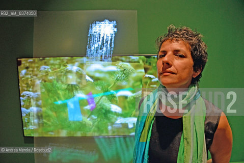 Lartista colombiana Monika Bravo accanto ad una sua video opera, esposta nel padiglione della Santa Sede, allArsenale, durante Biennale Arte 56°, Venezia 7 maggio 2015. © ANDREA MEROLA.The Colombian artist Monika Bravo next to a video of his work, exhibited in the Holy See Pavilion, at the Arsenale, during the 56th Art Biennale, Venice May 7th 2015.  ©Andrea Merola/Rosebud2