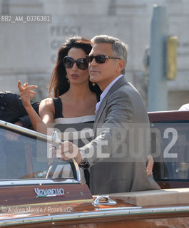 Amal Alamuddin e George Clooney , a Venezia per sposarsi, fotografati durante la corsa in motoscafo verso lhotel Cipriani, 26 settembre 2014..Amal Alamuddin and George Clooney, in Venice to get married, photographed during the speedboat ride to the hotel Cipriani, 26 September 2014. ©Andrea Merola/Rosebud2