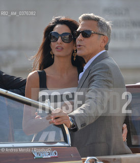 Amal Alamuddin e George Clooney , a Venezia per sposarsi, fotografati durante la corsa in motoscafo verso lhotel Cipriani, 26 settembre 2014..Amal Alamuddin and George Clooney, in Venice to get married, photographed during the speedboat ride to the hotel Cipriani, 26 September 2014. ©Andrea Merola/Rosebud2