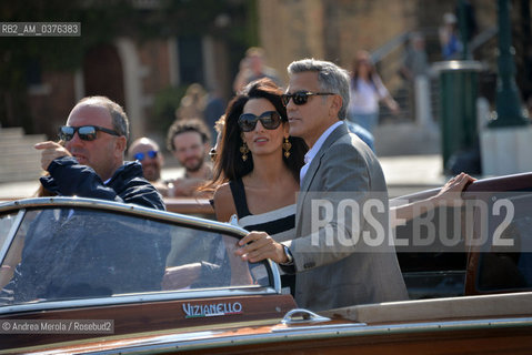 Amal Alamuddin e George Clooney , a Venezia per sposarsi, fotografati durante la corsa in motoscafo verso lhotel Cipriani, 26 settembre 2014..Amal Alamuddin and George Clooney, in Venice to get married, photographed during the speedboat ride to the hotel Cipriani, 26 September 2014. ©Andrea Merola/Rosebud2