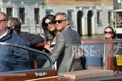 Amal Alamuddin e George Clooney , a Venezia per sposarsi, fotografati durante la corsa in motoscafo verso lhotel Cipriani, 26 settembre 2014..Amal Alamuddin and George Clooney, in Venice to get married, photographed during the speedboat ride to the hotel Cipriani, 26 September 2014. ©Andrea Merola/Rosebud2