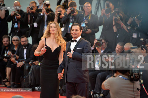 US actor/cast member Johnny Depp (R) and his wife US actress Amber Heard, arrive for the premiere of Black Mass, by Us director Scott Cooper, at the 72nd annual Venice International Film Festival, in Venice, Italy, 04 September 2015. .L’attore statunitense Johnny Depp e l’attrice Amber Heard sul red carpet della Mostra Internazionale d’Arte Cinematografica edizione 72, per prsentare il film “Black Mass”, diretto dal regiata statunitense Scott Cooper, Venezia  4 settembre 2015.... ©Andrea Merola/Rosebud2